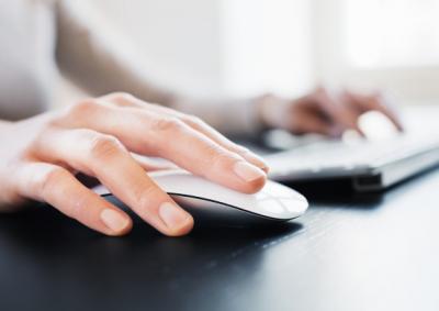 Picture of hands on a keyboard and mouse